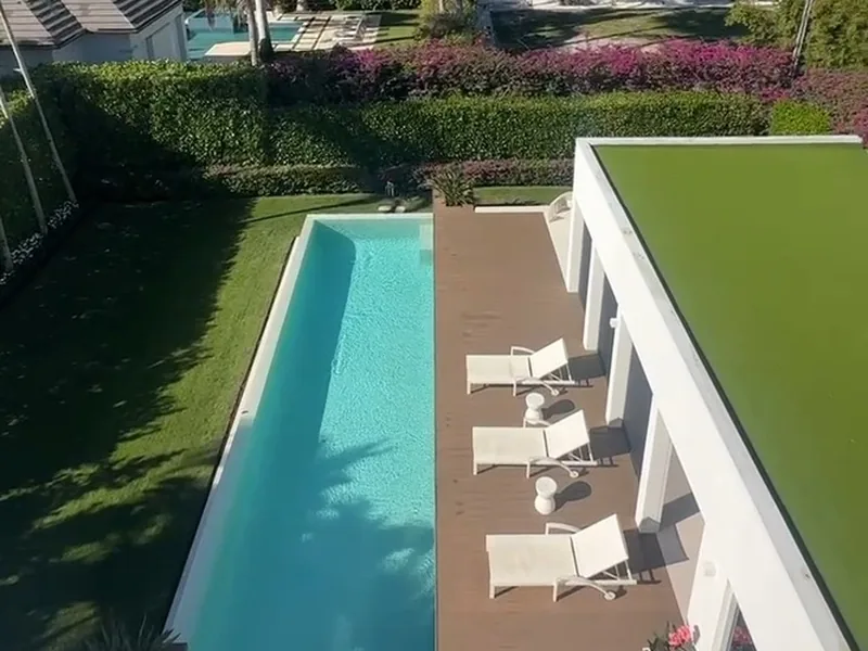 Modern pool home with an artificial turf green roof