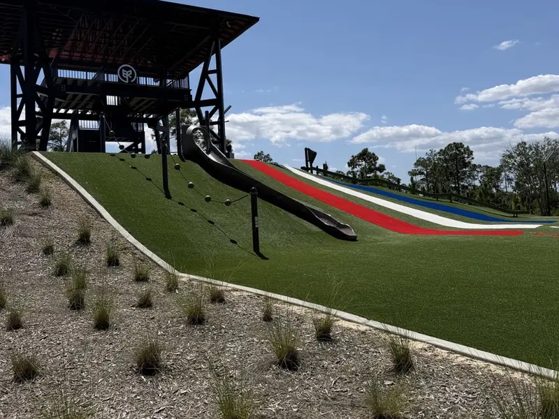 Artificial turf on a park hill slide at Babcock Ranch FL