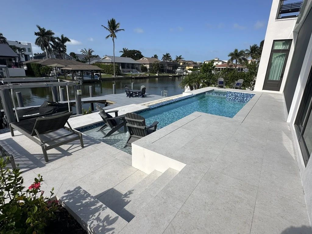 Pavers vs. Travertine for Your Florida Pool Deck