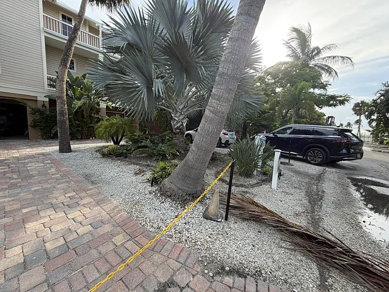 Captiva Island entry beds with shell rock and debris before turf