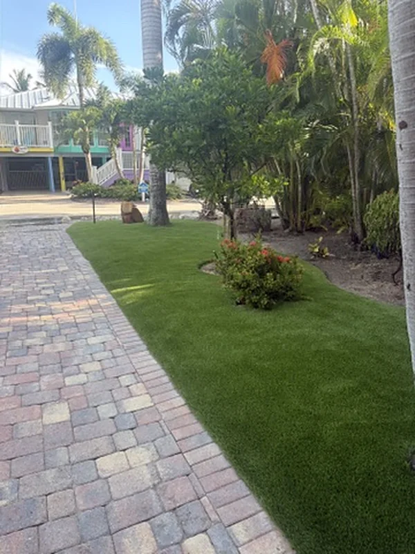 Artificial grass lawn along a paver walkway on Captiva Island