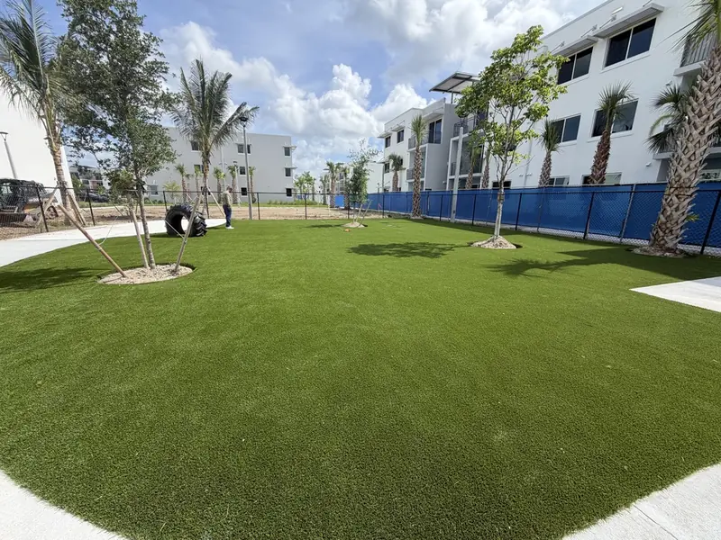 Large pet turf play lawn at an apartment community dog park in Naples FL