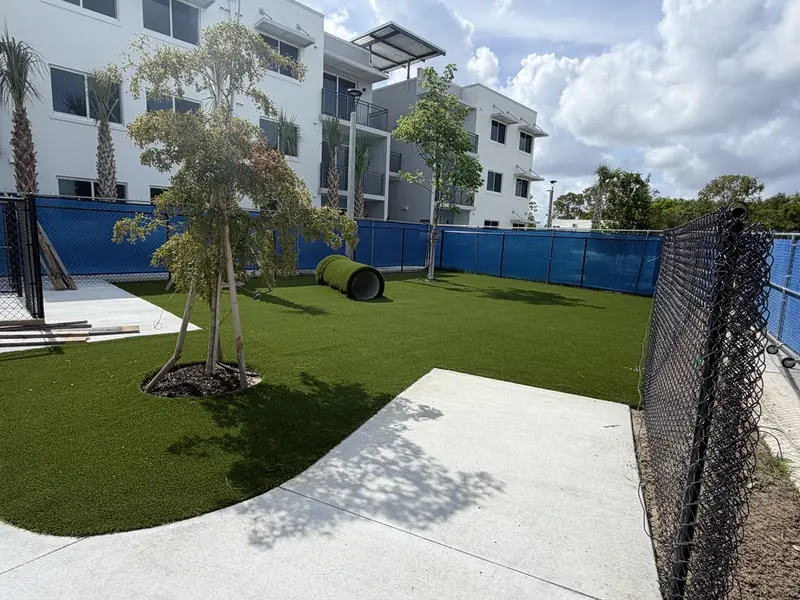 Commercial dog park with turf agility tunnel built by Creative Grounds in Naples
