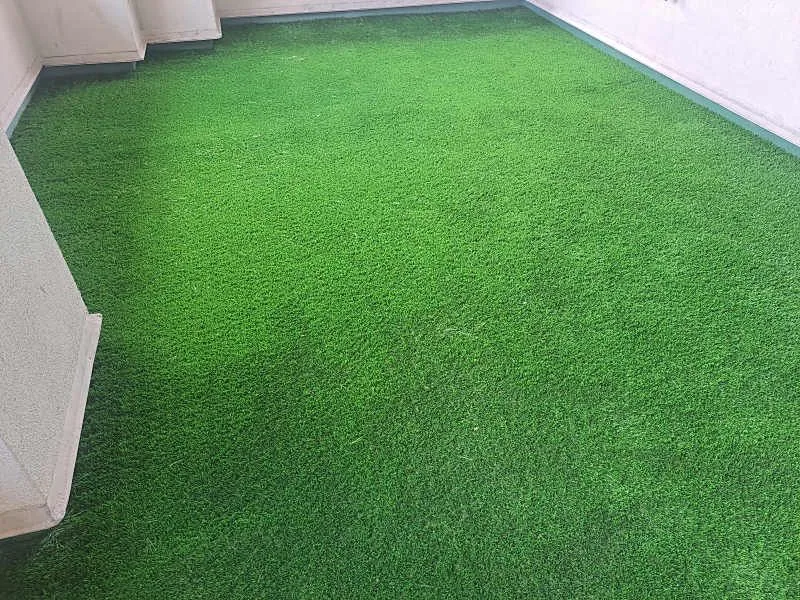 Condo balcony finished with wall-to-wall artificial turf
