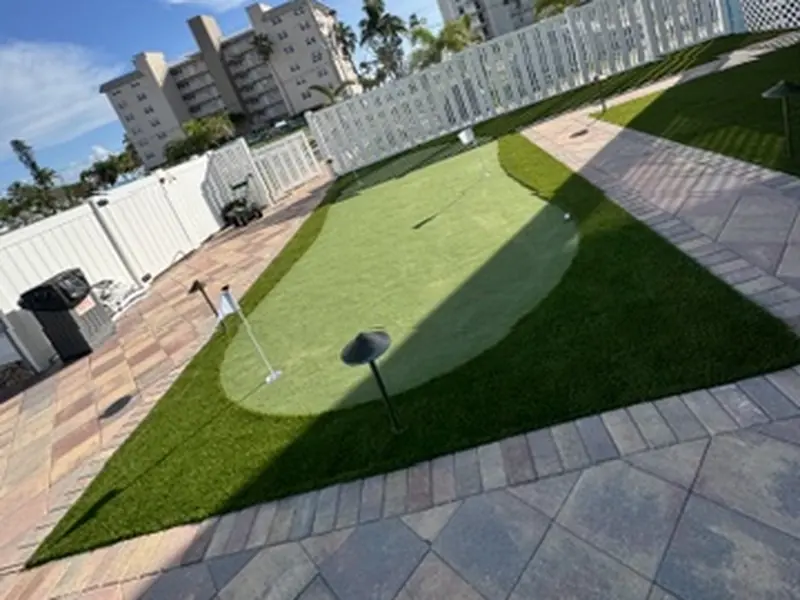 Putting green on a condo terrace with pavers