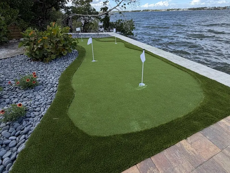Bayfront putting green with river rock border in Englewood FL
