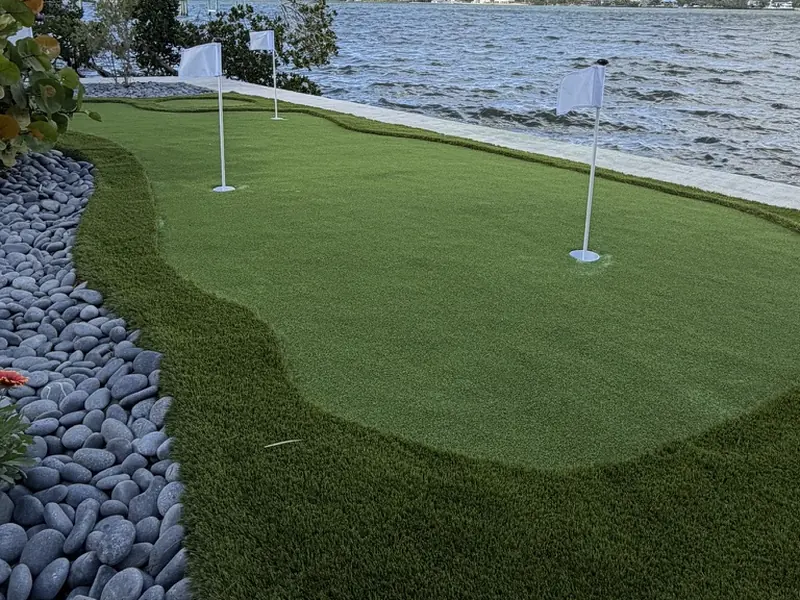 Putting green with fringe and river rock border in Englewood FL