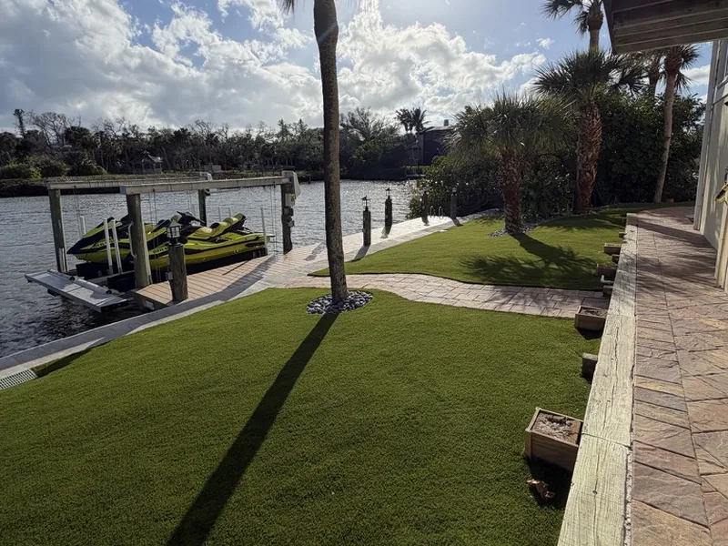 Artificial grass lawn with palm tree on the waterfront in Englewood