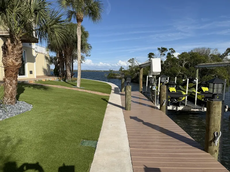 Artificial grass lawn along the seawall and dock in Englewood