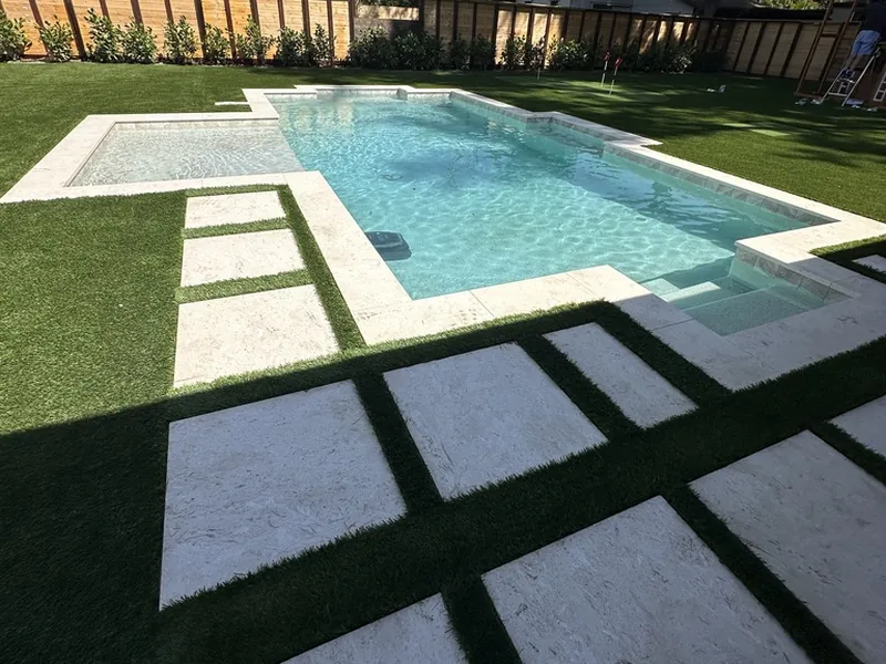 Fort Myers pool with stepping pads set in artificial turf