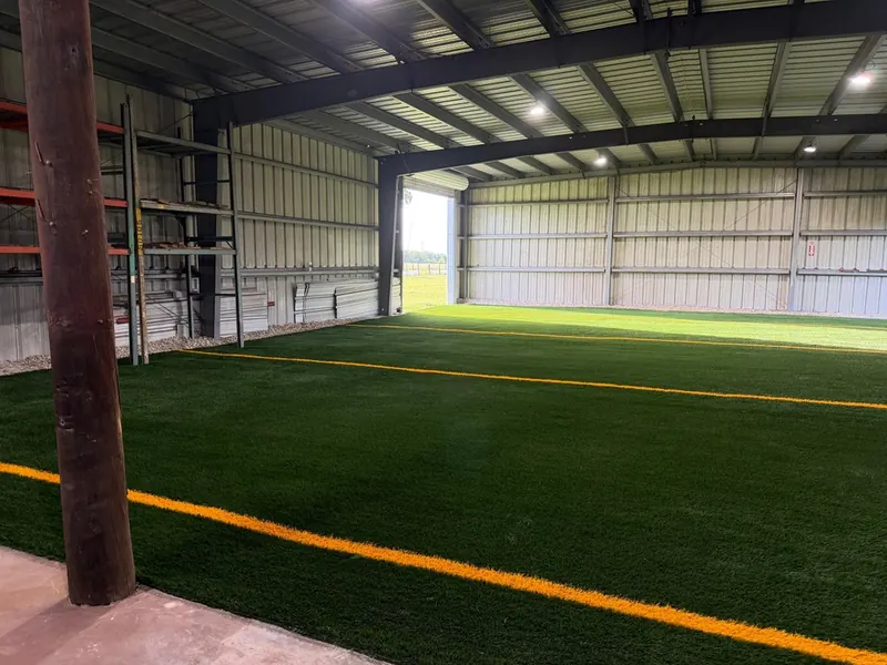 Covered training building with wall-to-wall sports turf