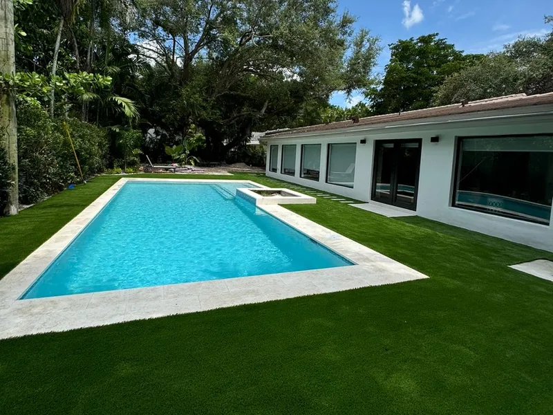 Modern pool home with wall-to-wall artificial grass