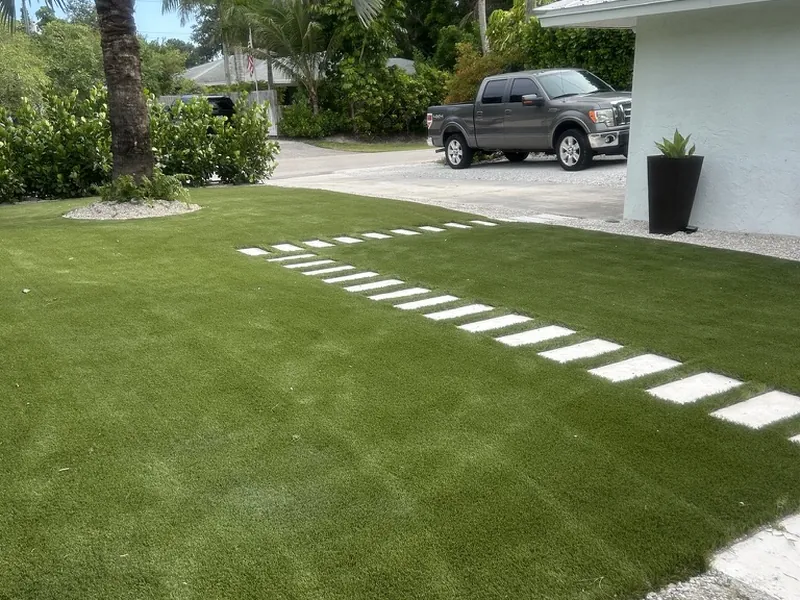 Naples front lawn with artificial turf and stepping path