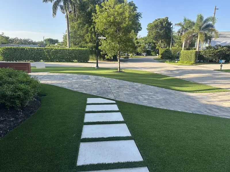 Stone stepping pads beside the drive in Naples, FL by Creative Grounds