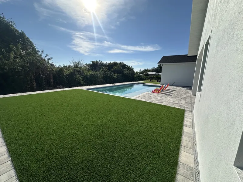 New construction pool backyard with artificial turf in Fort Myers