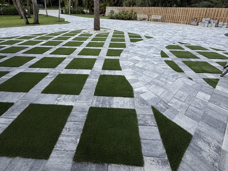 After: paver and artificial turf grid courtyard by Creative Grounds in Bonita Springs FL