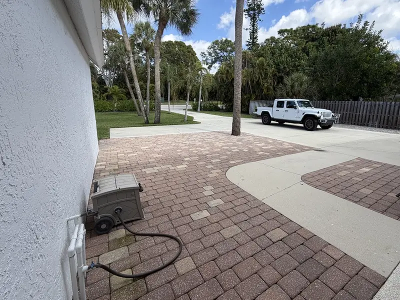 Before: faded brick pavers and concrete driveway at a Bonita Springs home
