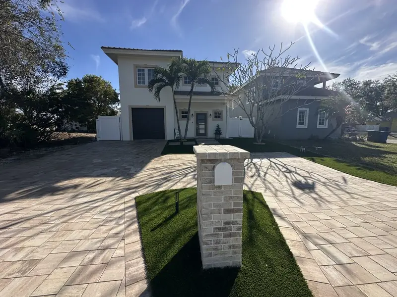 Driveway extension with brick mailbox by Creative Grounds at the Pink House in Bonita Springs FL