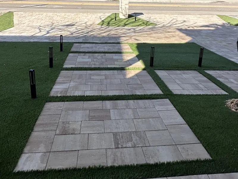 Paver pads to the front door by Creative Grounds at the Pink House in Bonita Springs FL
