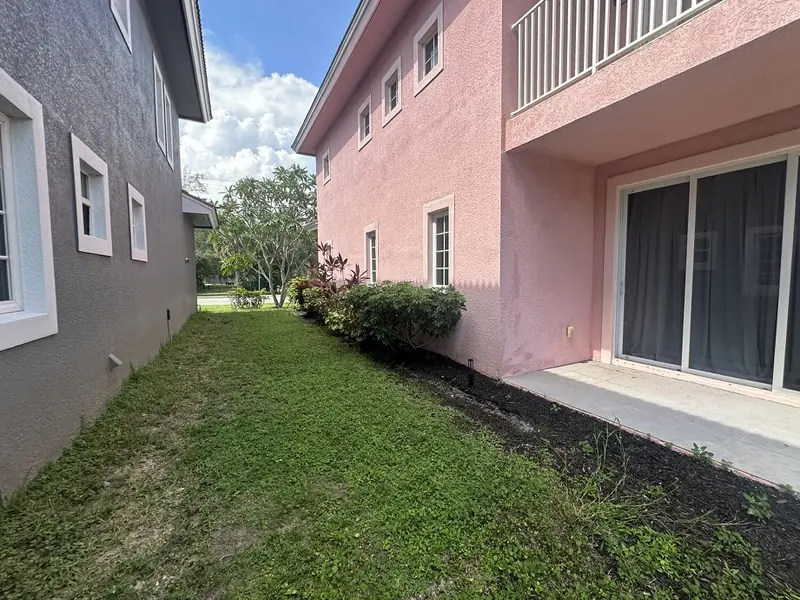 Before: side yard at the Pink House in Bonita Springs FL