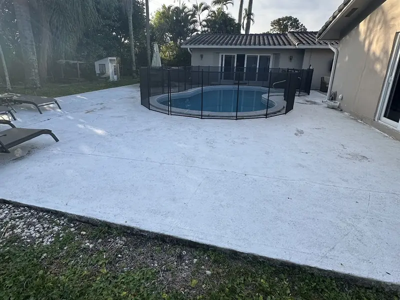 Before: stained concrete pool deck