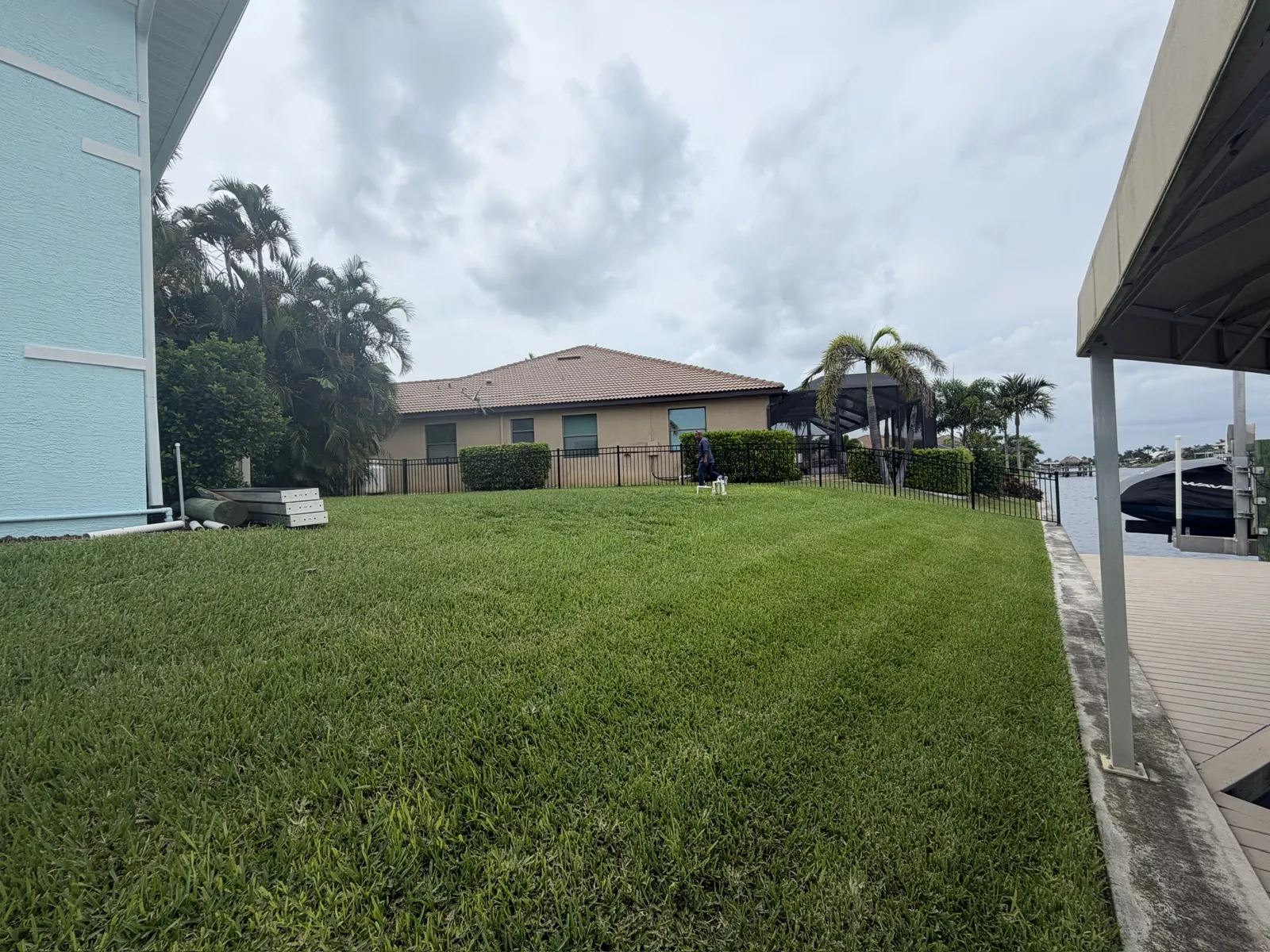 Established real sod lawn on a canal-front backyard