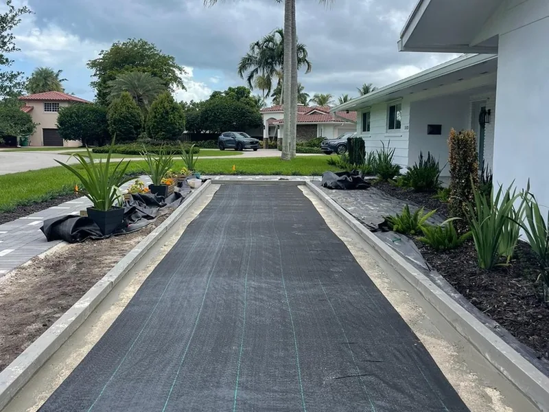 Palmetto Bay bocce court under construction with borders, compacted base and weed barrier