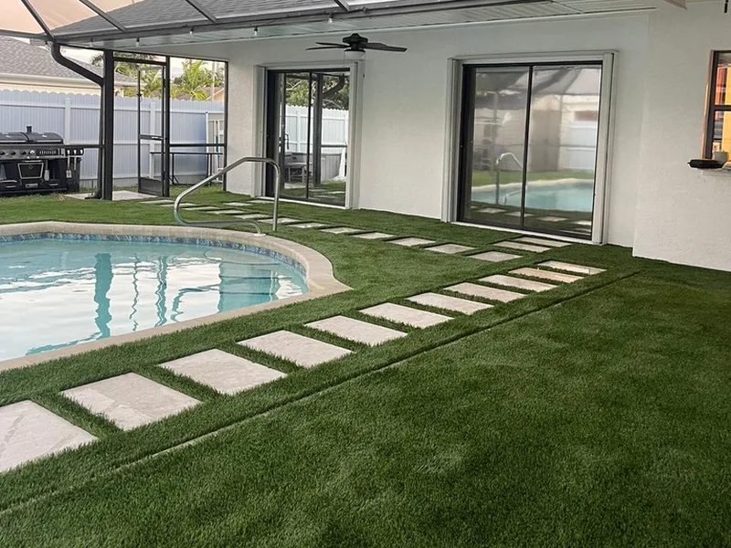 Artificial turf and stepping pads from the sliding doors to the pool