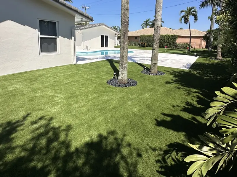 After: Pet turf side yard with tree rings installed by Creative Grounds