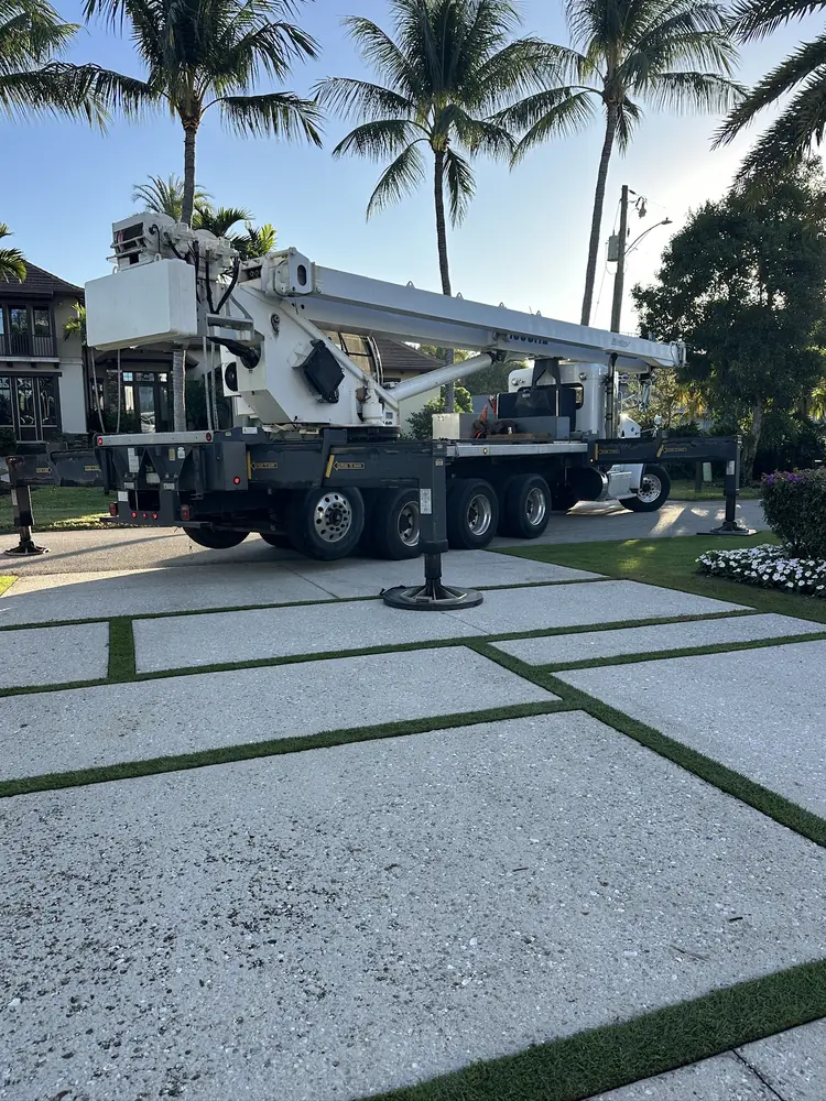 Large-format pavers with turf joints in Naples, FL by Creative Grounds