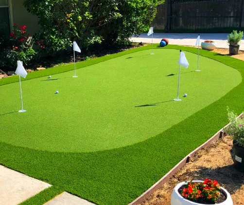 Backyard putting green by Creative Grounds for Estero homeowners